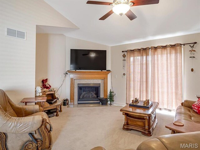 105 Megan Ct, Valmeyer, IL 62295 - living area featuring lofted ceiling, carpet floors, ceiling fan, and a glass covered fireplace