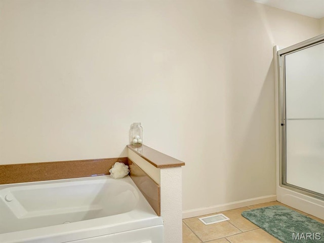 105 Megan Ct, Valmeyer, IL 62295 - full bath with a garden tub, tile patterned flooring, a shower stall, and baseboards