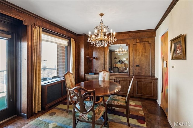 4466 W Pine Blvd Unit 15C, Saint Louis, MO 63108 - dining area with a chandelier, baseboards, and ornamental molding