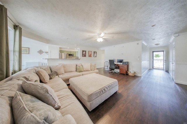 840 Herndon Rd, Lebanon, MO 65536 - living room with a desk, dark wood-style floors, ceiling fan, a textured ceiling, and baseboards