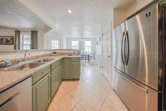 840 Herndon Rd, Lebanon, MO 65536 - kitchen with appliances with stainless steel finishes, green cabinets, a sink, a textured ceiling, and light tile patterned flooring