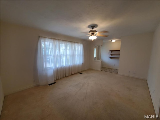528 Dogwood Ln, Houston, MO 65483 - empty room featuring ceiling fan, light carpet, and baseboards