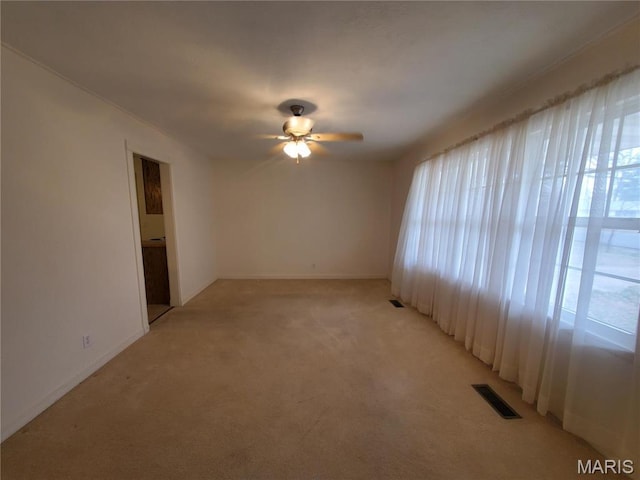 528 Dogwood Ln, Houston, MO 65483 - empty room featuring light colored carpet, ceiling fan, and baseboards