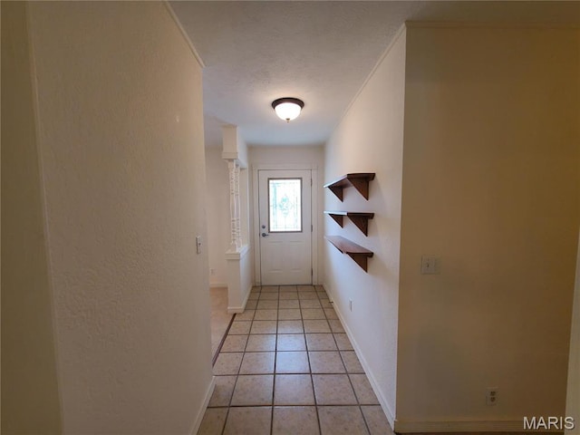 528 Dogwood Ln, Houston, MO 65483 - doorway with a textured wall, baseboards, and light tile patterned floors