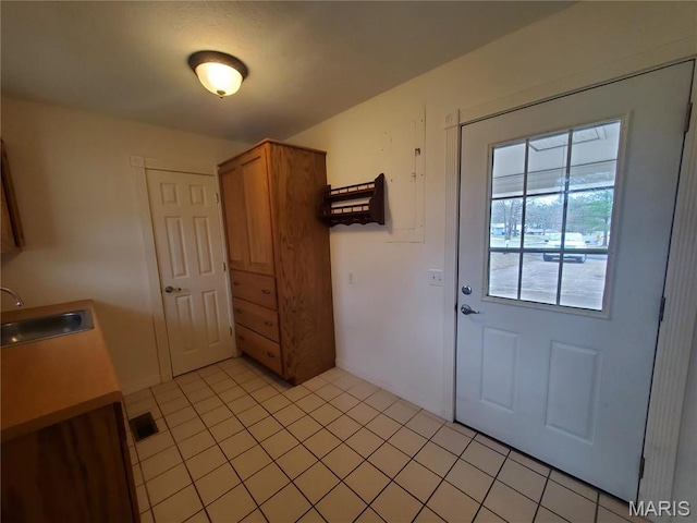 528 Dogwood Ln, Houston, MO 65483 - doorway to outside featuring a sink and light tile patterned floors