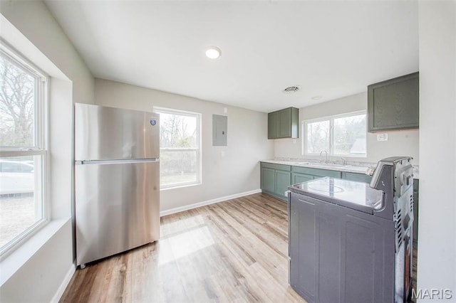 713 N Oak St, Salem, MO 65560 - kitchen featuring freestanding refrigerator, washer / dryer, electric panel, baseboards, and recessed lighting