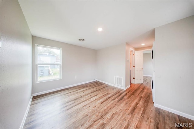 713 N Oak St, Salem, MO 65560 - empty room with wood finished floors, baseboards, and recessed lighting