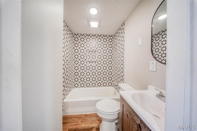 713 N Oak St, Salem, MO 65560 - bathroom featuring toilet, wood finished floors, vanity, and bathing tub / shower combination