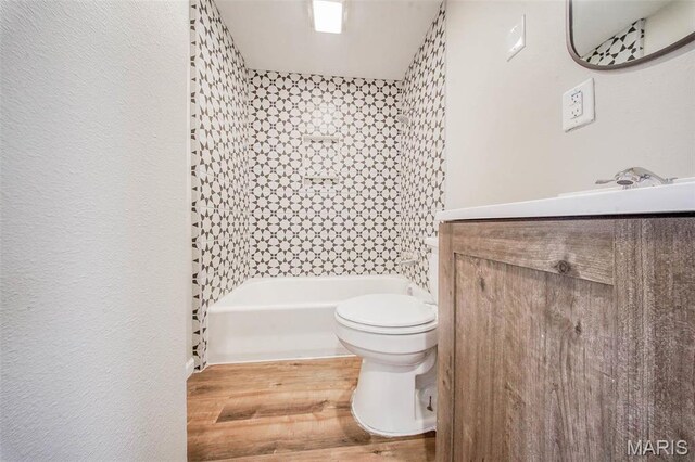713 N Oak St, Salem, MO 65560 - full bath with wood finished floors, toilet, and vanity