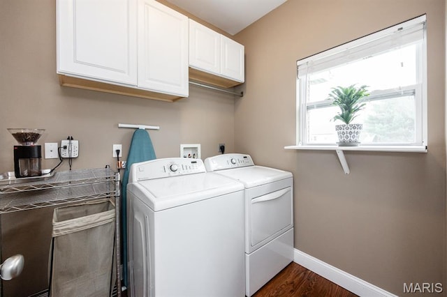 clothes washing area featuring independent washer and dryer, cabinet space, baseboards, and dark wood-style flooring
