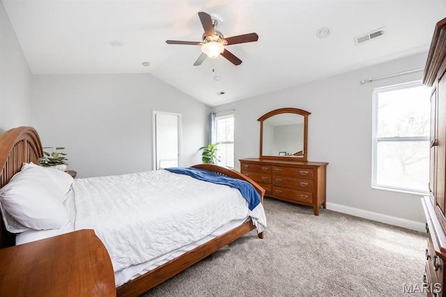bedroom with lofted ceiling, carpet, baseboards, and a ceiling fan