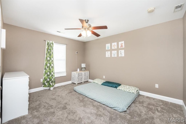 carpeted bedroom with baseboards and ceiling fan