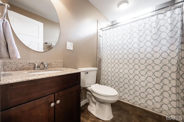 bathroom with toilet, vanity, and a shower with shower curtain