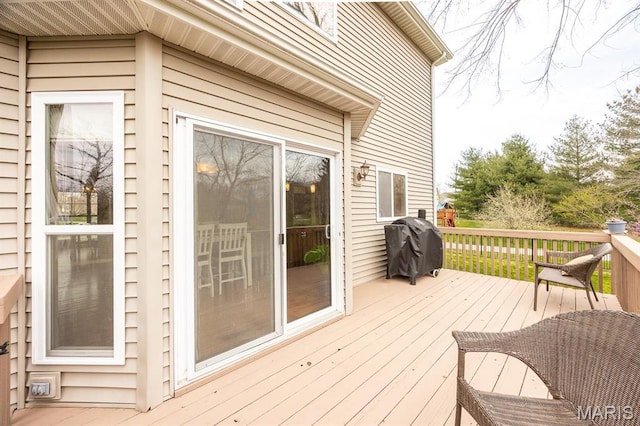 wooden terrace with area for grilling