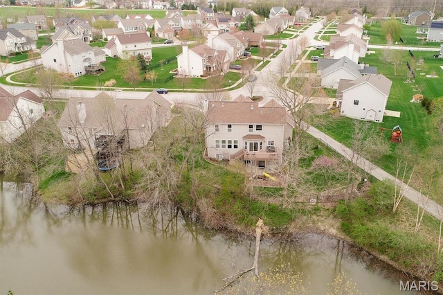 aerial perspective of suburban area with a large body of water