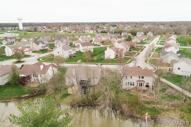 aerial overview of property's location featuring nearby suburban area and a large body of water