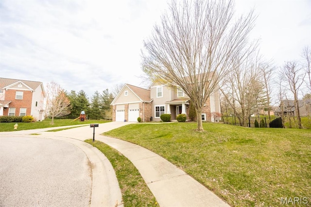 traditional-style home featuring driveway and brick siding