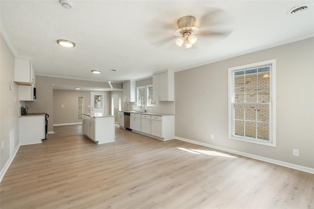 1107 Hickory St, Poplar Bluff, MO 63901 - kitchen featuring crown molding, dishwasher, a ceiling fan, baseboards, and light wood finished floors