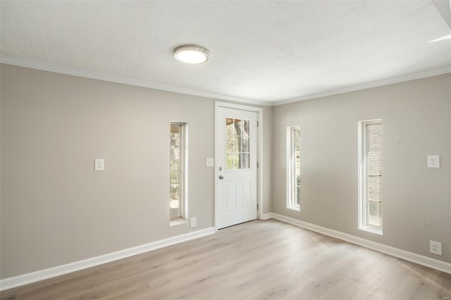 1107 Hickory St, Poplar Bluff, MO 63901 - entrance foyer featuring light wood finished floors, crown molding, and baseboards
