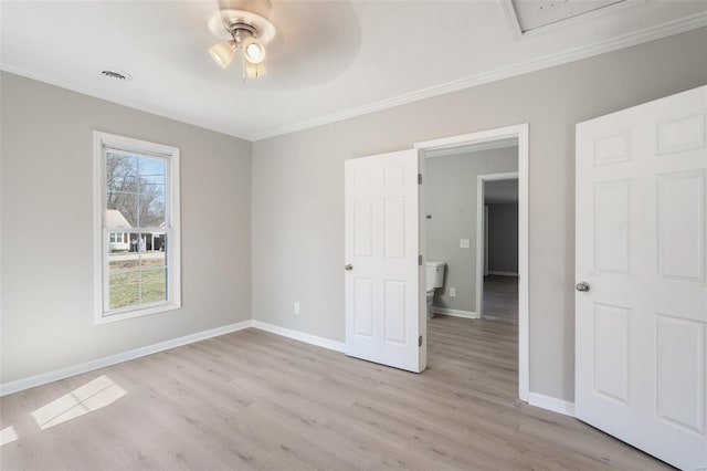 1107 Hickory St, Poplar Bluff, MO 63901 - unfurnished bedroom with crown molding, light wood-type flooring, baseboards, ceiling fan, and attic access