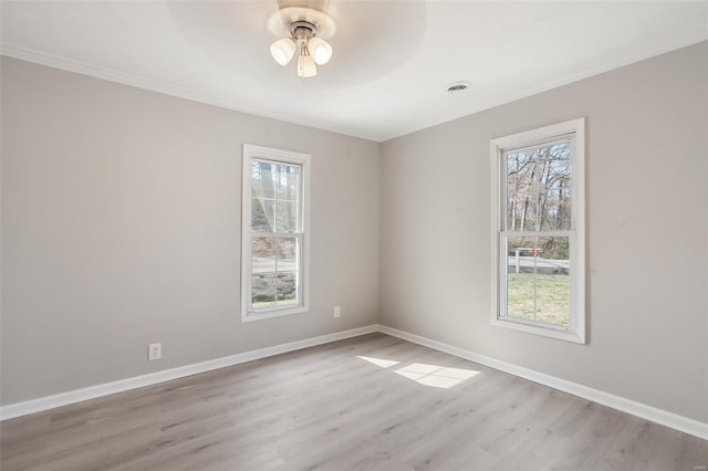 1107 Hickory St, Poplar Bluff, MO 63901 - empty room with ornamental molding, a ceiling fan, wood finished floors, and baseboards