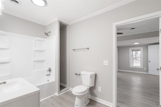 1107 Hickory St, Poplar Bluff, MO 63901 - full bath with wood finished floors, toilet, baseboards, crown molding, and washtub / shower combination