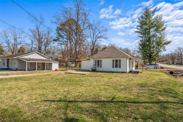 1107 Hickory St, Poplar Bluff, MO 63901 - rear view of house featuring a yard and a carport