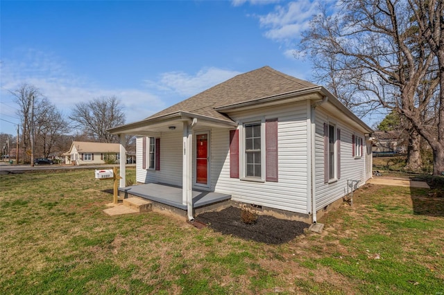 1107 Hickory St, Poplar Bluff, MO 63901 - view of front of property featuring a porch, a front lawn, roof with shingles, and crawl space