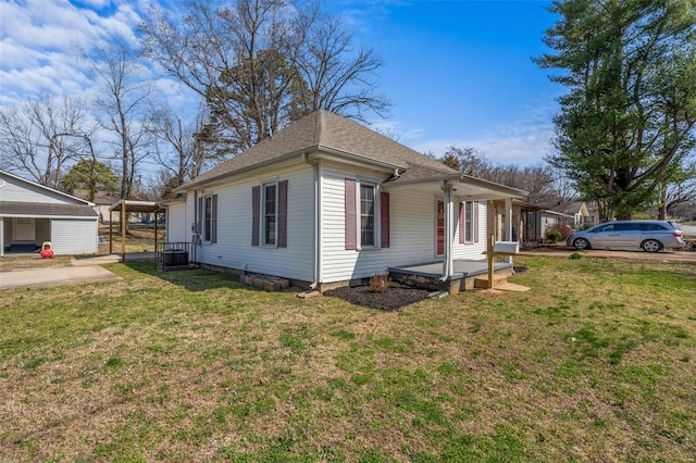 1107 Hickory St, Poplar Bluff, MO 63901 - view of property exterior with a yard and a shingled roof
