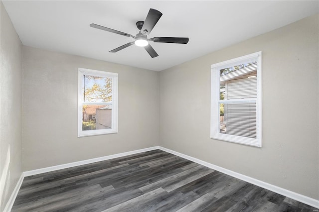 3438 Pine Grove Ave, Saint Louis, MO 63121 - empty room with dark wood-type flooring, baseboards, and ceiling fan
