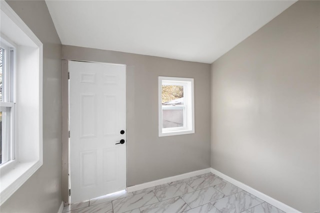 3438 Pine Grove Ave, Saint Louis, MO 63121 - spare room featuring light marble finish flooring and baseboards