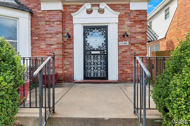 property entrance with brick siding