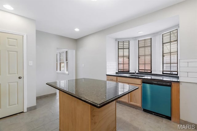 kitchen featuring dishwasher, plenty of natural light, a kitchen island, recessed lighting, and light tile patterned flooring
