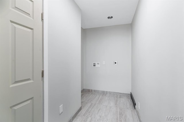 laundry room with hookup for an electric dryer, hookup for a washing machine, and baseboards