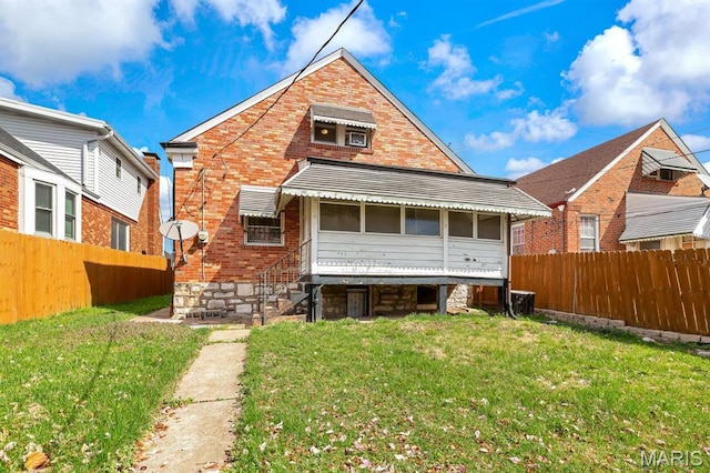 back of house featuring brick siding