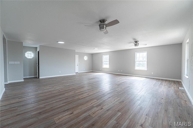 11717 County Road 385, Holts Summit, MO 65043 - unfurnished room featuring a ceiling fan, wood finished floors, baseboards, and a textured ceiling