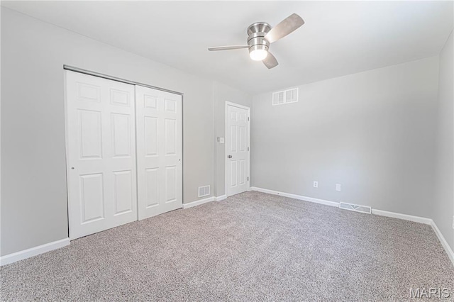 11717 County Road 385, Holts Summit, MO 65043 - unfurnished bedroom featuring carpet floors, baseboards, a closet, and ceiling fan