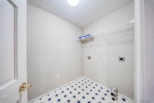 1106 Grandsir Ave, Rolla, MO 65401 - laundry area featuring hookup for an electric dryer, tile patterned floors, hookup for a washing machine, and baseboards