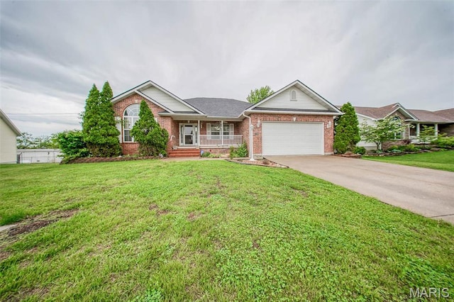1106 Grandsir Ave, Rolla, MO 65401 - single story home featuring brick siding, a garage, concrete driveway, covered porch, and a front yard