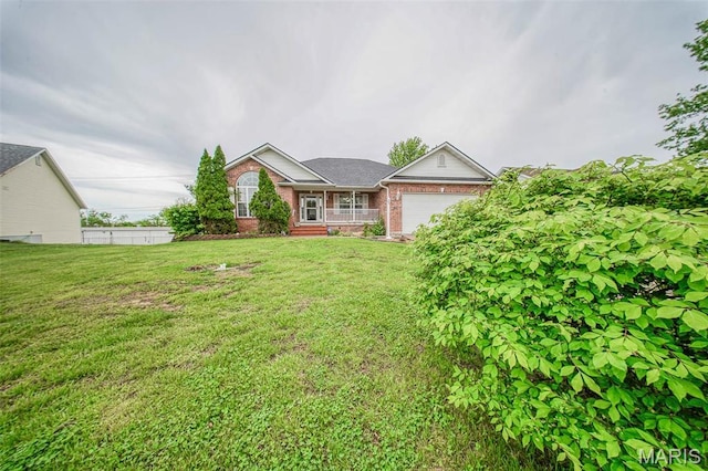 1106 Grandsir Ave, Rolla, MO 65401 - ranch-style home featuring brick siding, a garage, and a front yard
