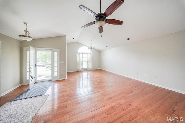 1106 Grandsir Ave, Rolla, MO 65401 - unfurnished living room featuring a chandelier, a ceiling fan, light wood-style flooring, lofted ceiling, and baseboards