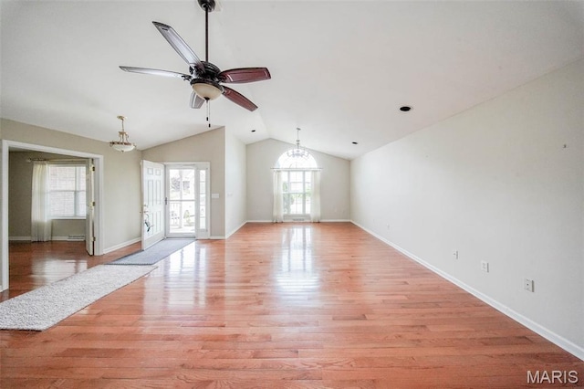 1106 Grandsir Ave, Rolla, MO 65401 - unfurnished living room with a chandelier, ceiling fan, lofted ceiling, light wood-style floors, and baseboards