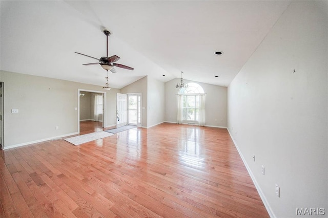 1106 Grandsir Ave, Rolla, MO 65401 - unfurnished living room with vaulted ceiling, a ceiling fan, light wood finished floors, baseboards, and a chandelier