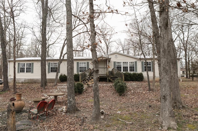 25125 Ash Dr, Grovespring, MO 65662 - manufactured / mobile home featuring a wooden deck