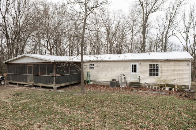 25125 Ash Dr, Grovespring, MO 65662 - back of property featuring a sunroom, metal roof, entry steps, a yard, and crawl space