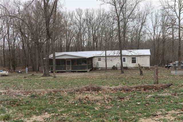 25125 Ash Dr, Grovespring, MO 65662 - view of front of property featuring a sunroom and metal roof