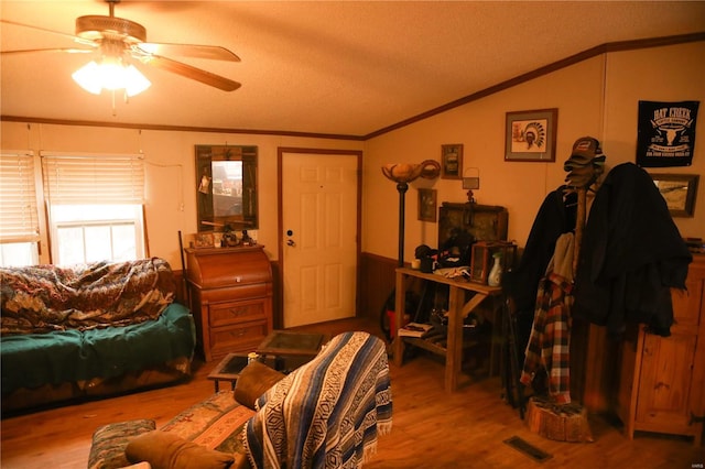 25125 Ash Dr, Grovespring, MO 65662 - living room with lofted ceiling, ceiling fan, a textured ceiling, wood finished floors, and ornamental molding