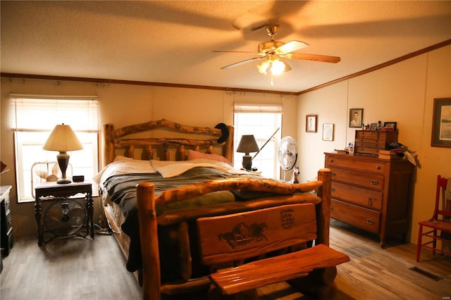 25125 Ash Dr, Grovespring, MO 65662 - bedroom with crown molding, wood finished floors, and a ceiling fan