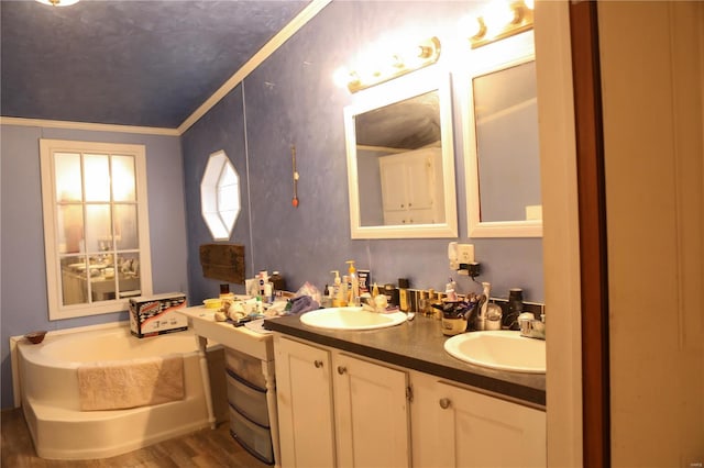 25125 Ash Dr, Grovespring, MO 65662 - bathroom with wood finished floors, ornamental molding, a bath, and double vanity