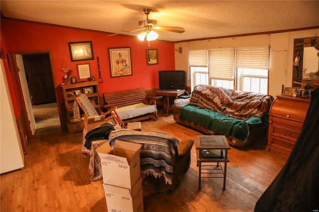25125 Ash Dr, Grovespring, MO 65662 - living room with wood finished floors, a ceiling fan, ornamental molding, vaulted ceiling, and a textured ceiling